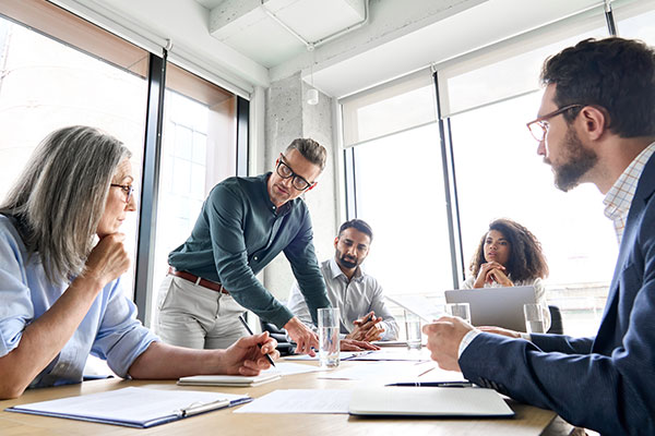 leader with diverse coworkers team
