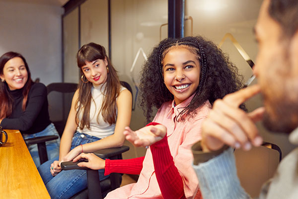 people sitting at a table talking