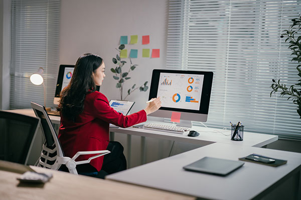 person reviewing financial analytics on computer display