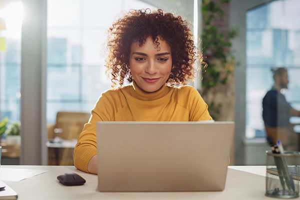 Person using Laptop Computer in Marketing Agency