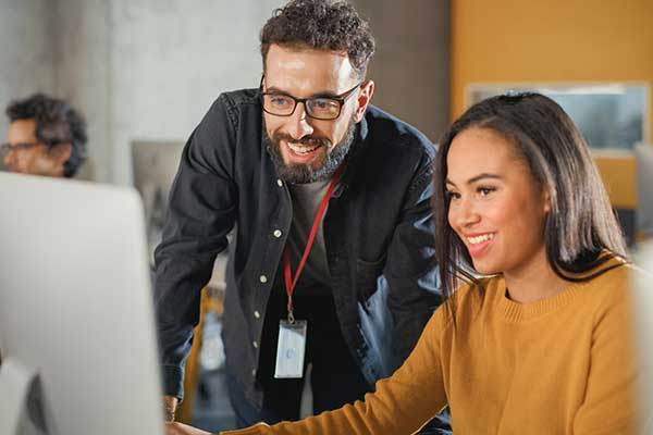 Teacher and student smiling