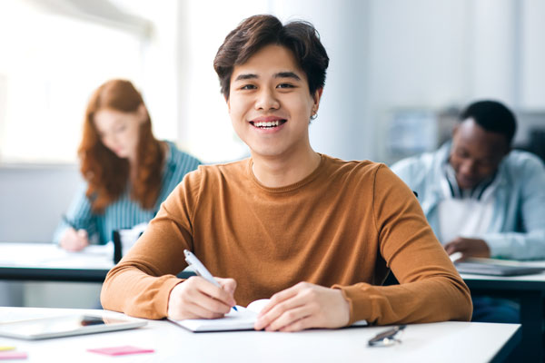 Smiling student at desk